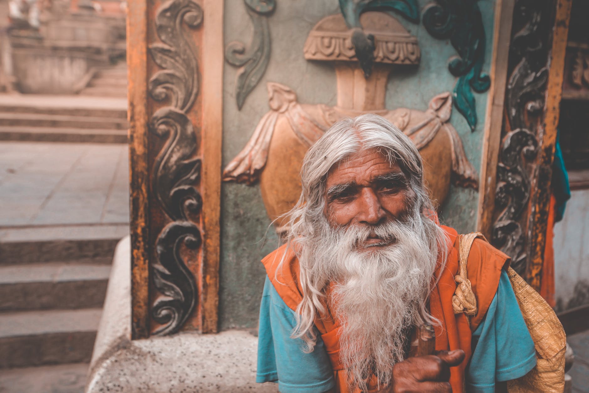 elderly hindu man with gray beard in town; stock character; old wise person