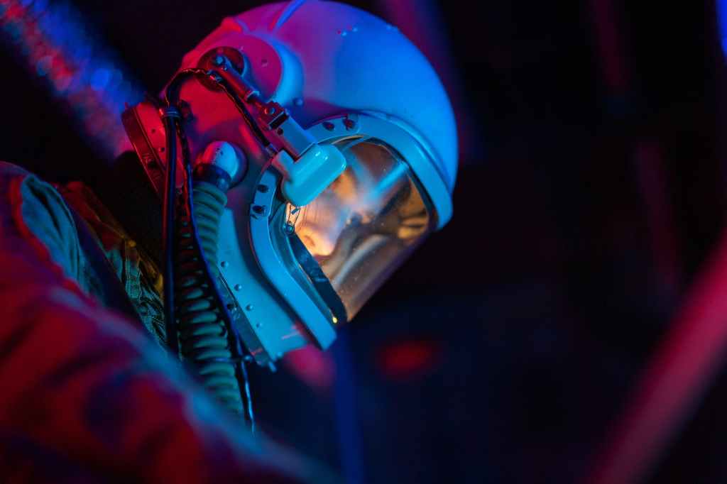 woman in a spacesuit with blue helmet