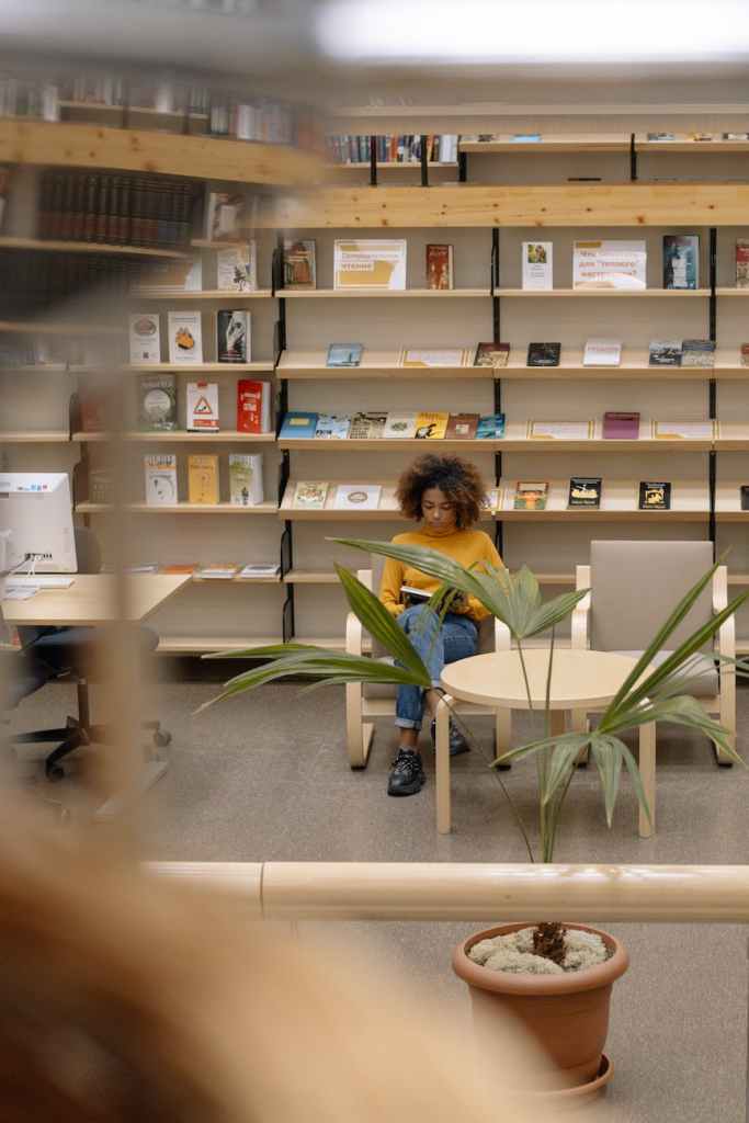 photo of woman reading a book