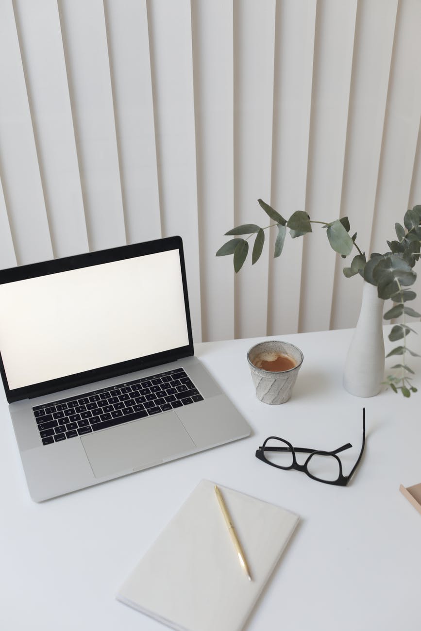creative workplace with laptop and notebook 