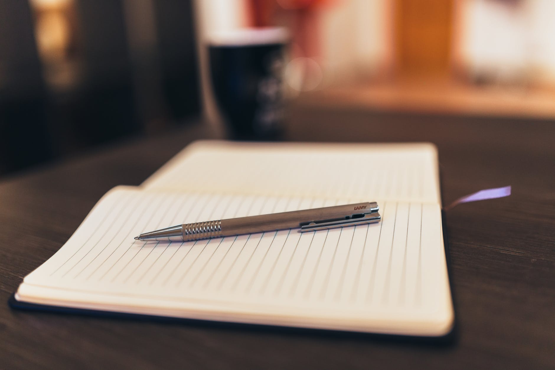 coffee notebook pen writing; writers weeks