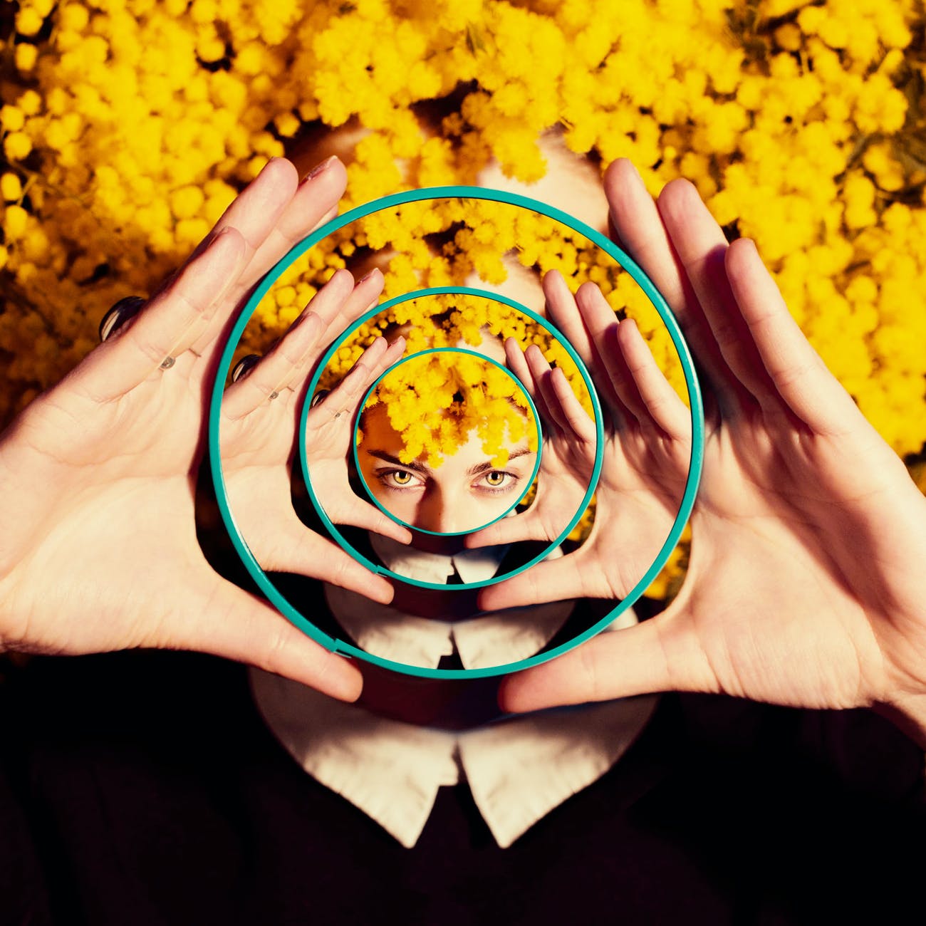 photo of woman holding a mirror; What is Magical Realism?