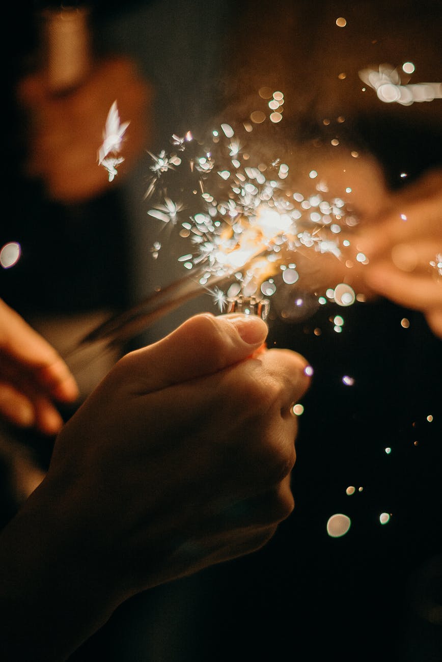 person holding sparkler