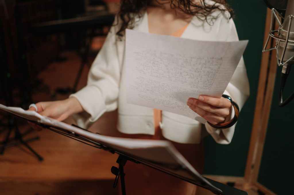 close up shot of an artist holding a paper