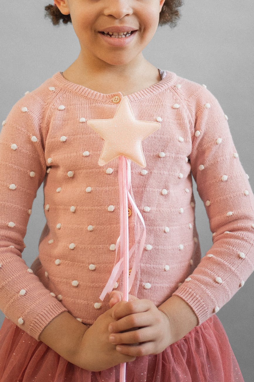 cheerful faceless princess black girl with magic wand