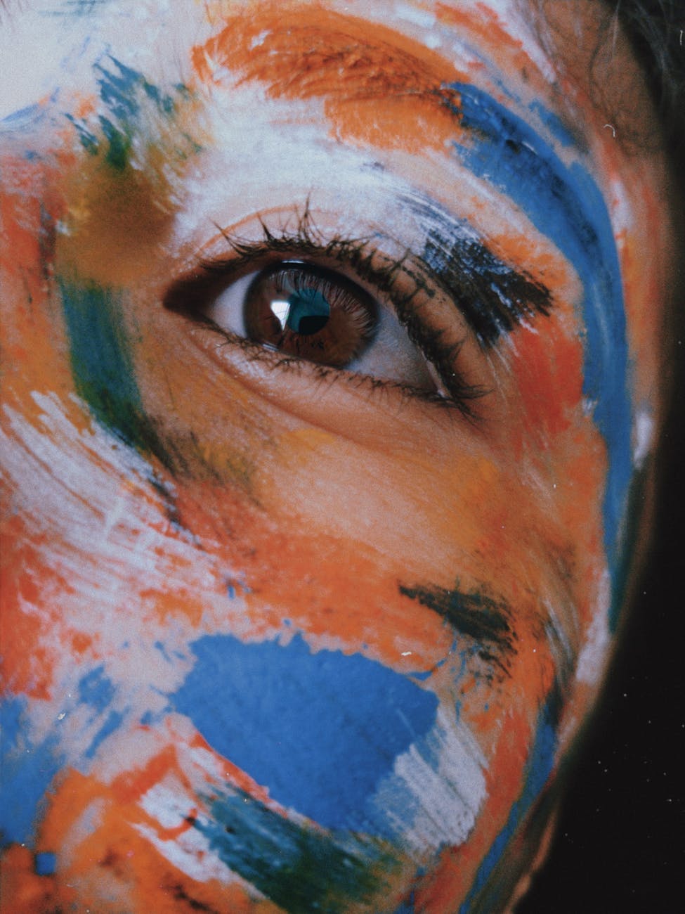 person colorful face paint