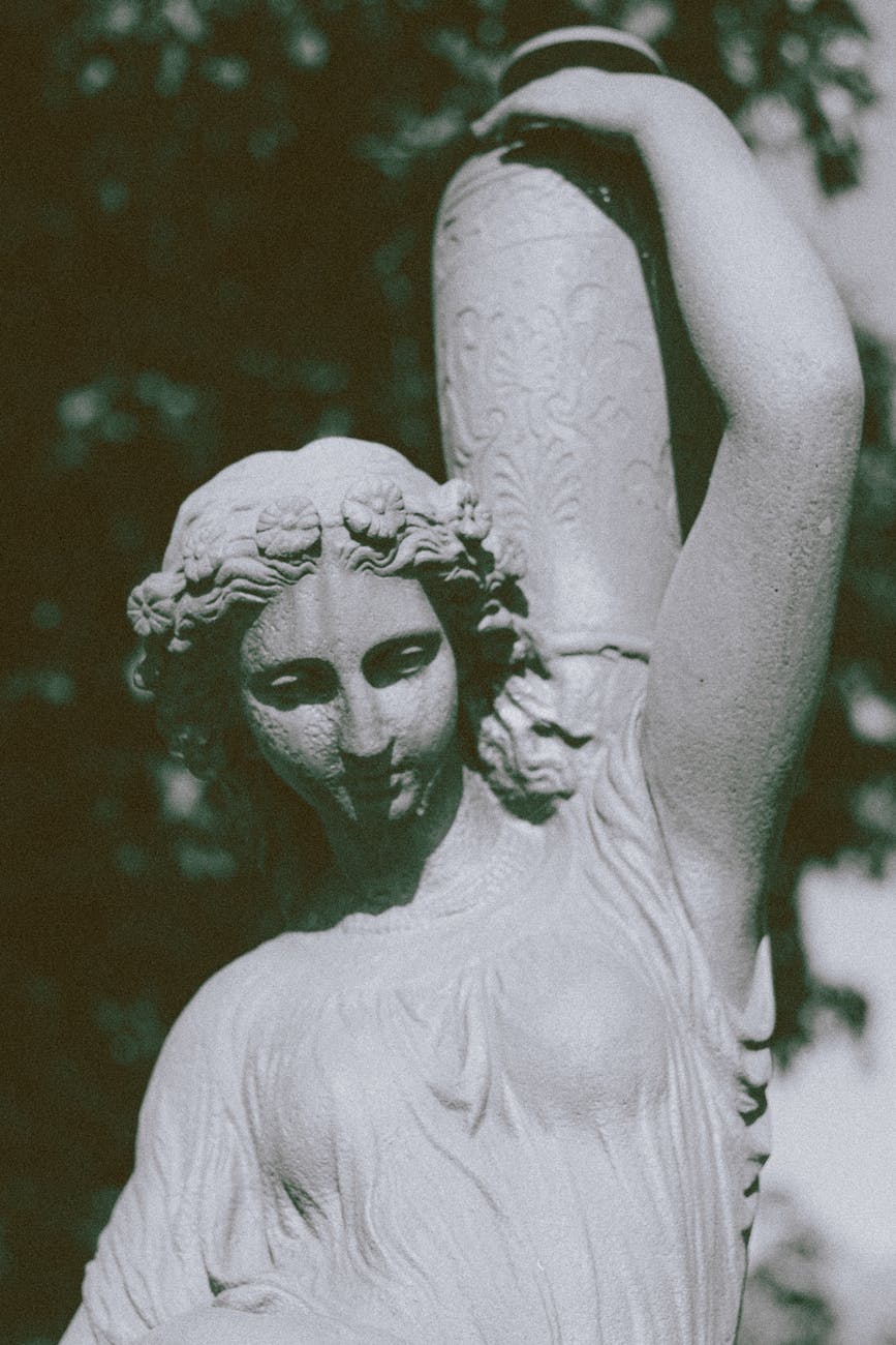 ancient statue of woman with vase