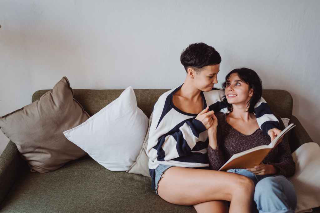 smiling couple with book