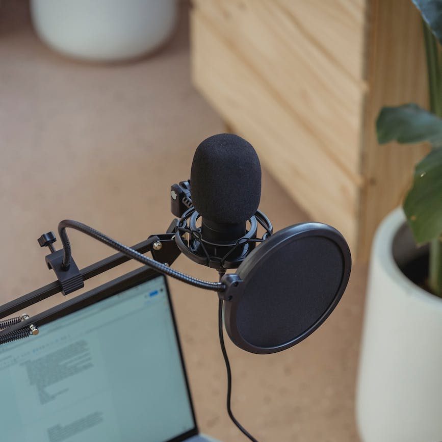 microphone on tripod attached to laptop in studio